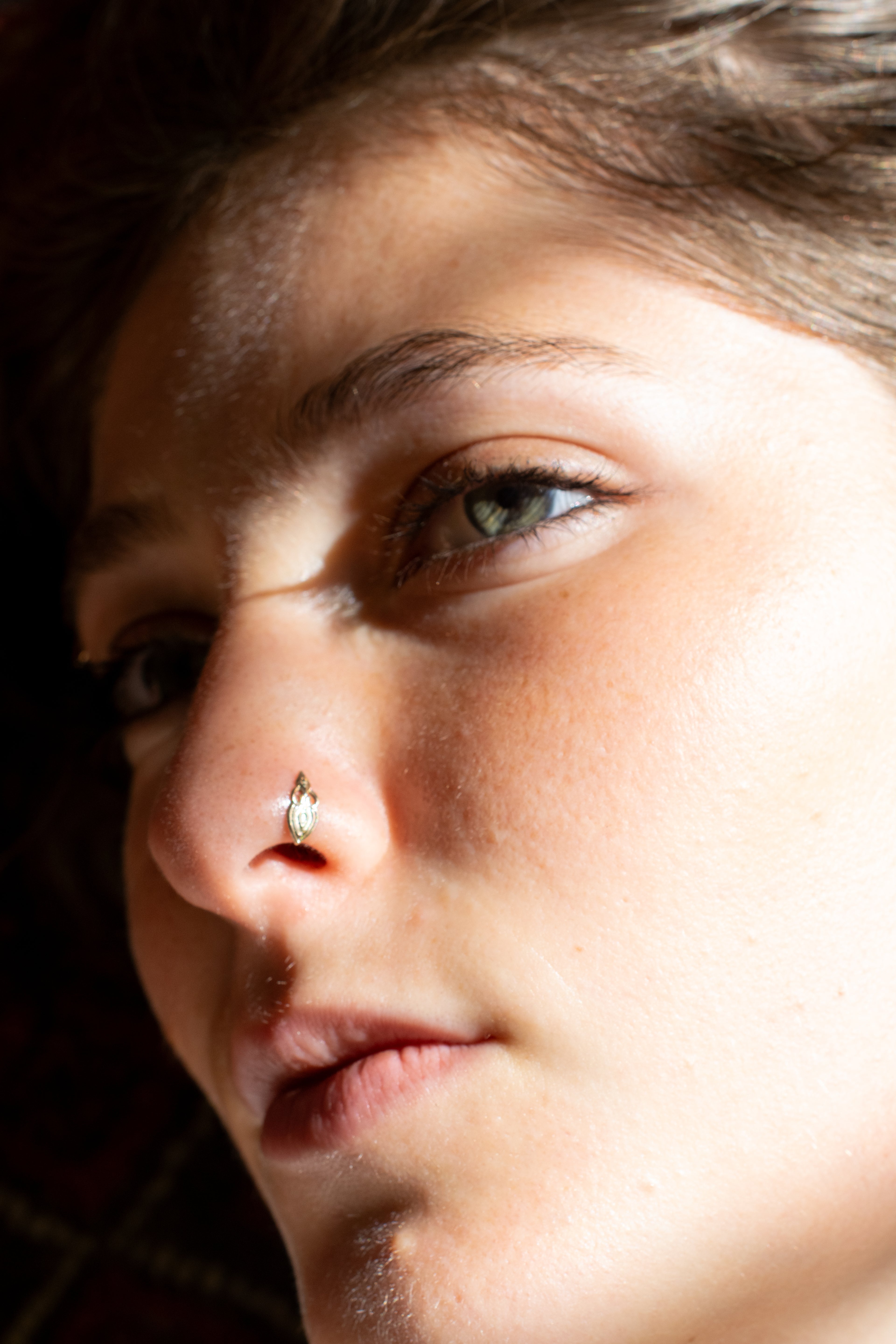The gold nose ring
