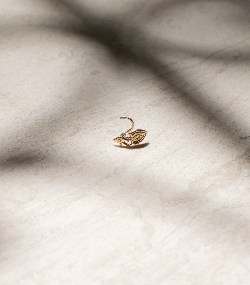 a gold nose ring portrait